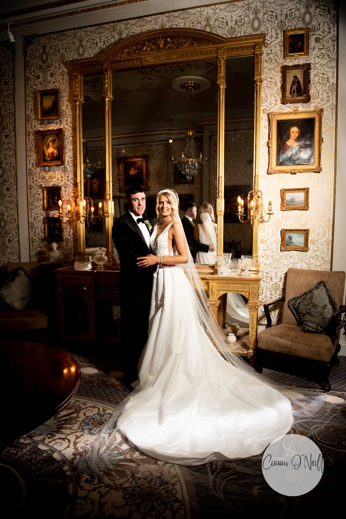Couple embracing in the Gold Room of Cabra Castle