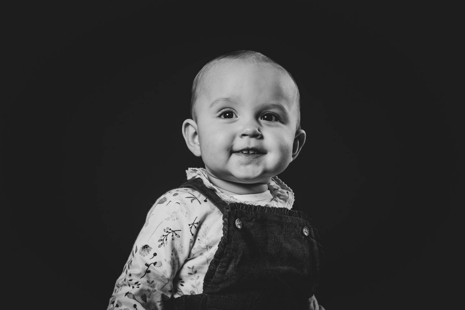 A 1 year old baby laughing at the lens - January 2023 Portrait Highlight - Portrait Photogrsphers Northern Ireland - Ciaran O'Neill Photography