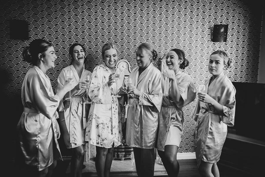 Bridal party enjoying a drink and the craic during the wedding prep at the Bride's family home