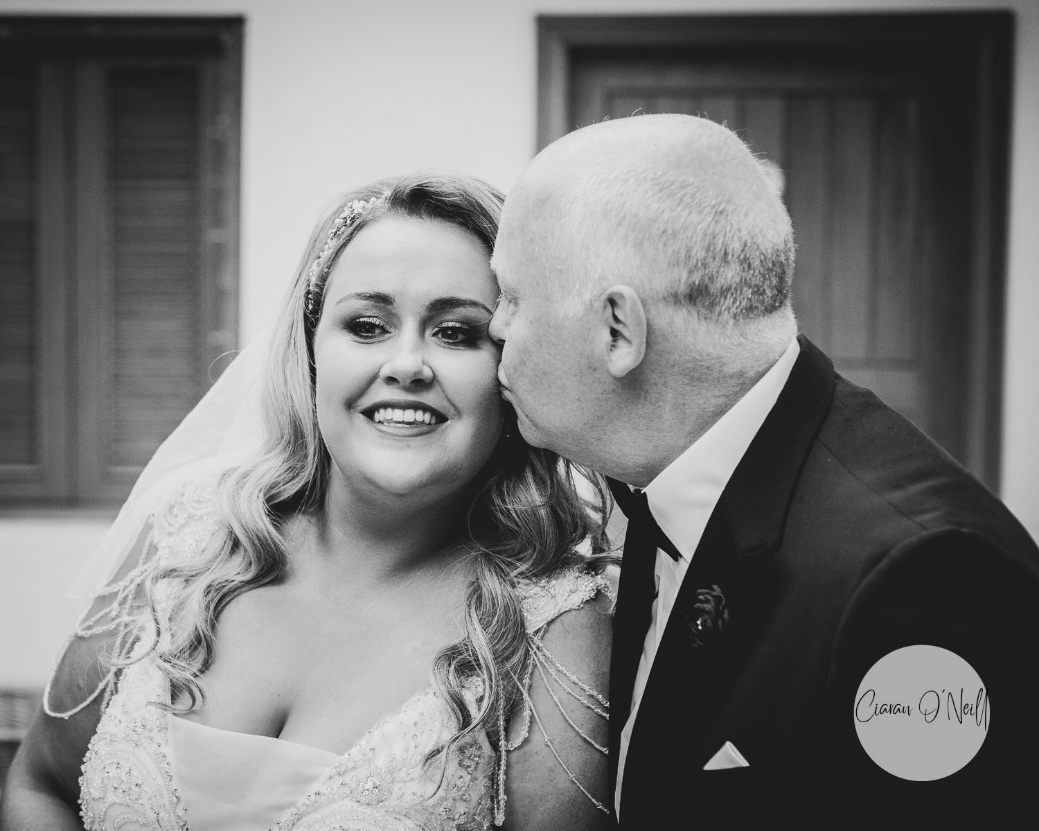 Dad and bride share a wee kiss on the cheeks before she walks down the aisle