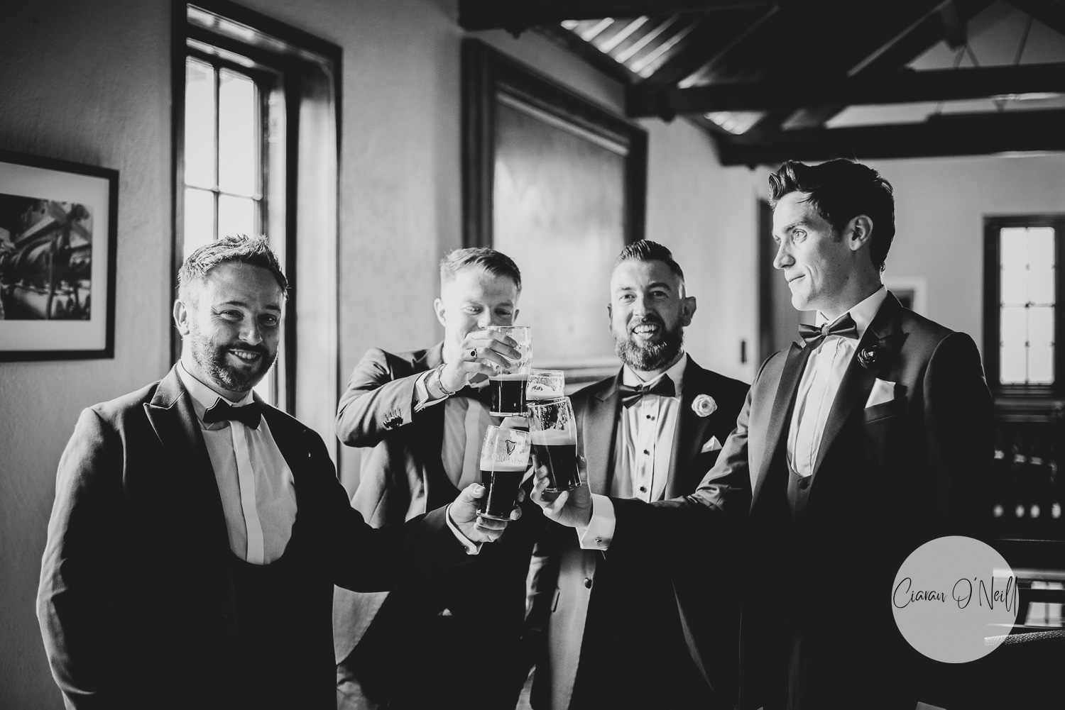 Groomsmen enjoying a pint of Guinness