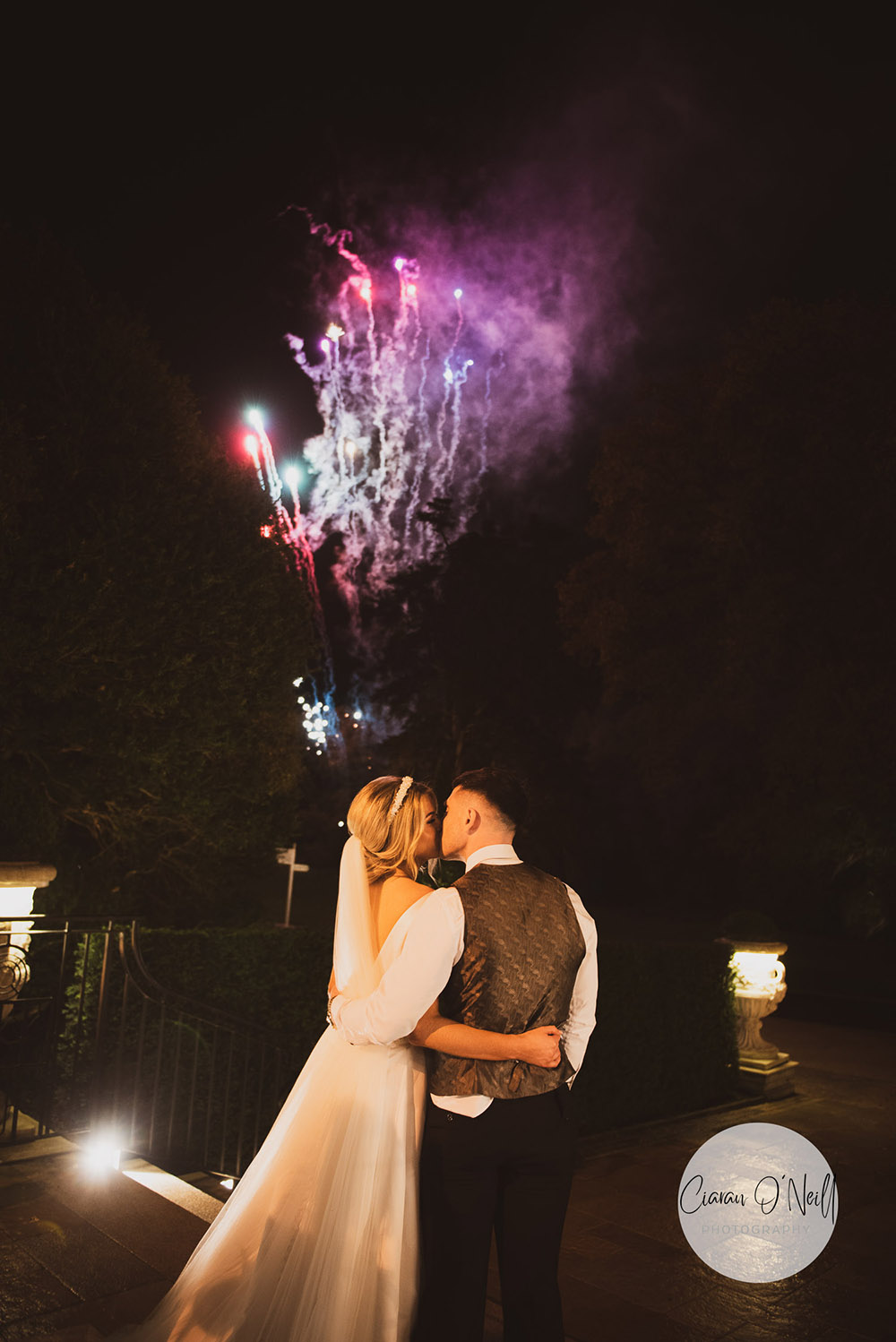 Bride and groom kissing in front of fireworks Cabra Castle Wedding Photographer Northern Ireland Ciaran O'Neill Photography