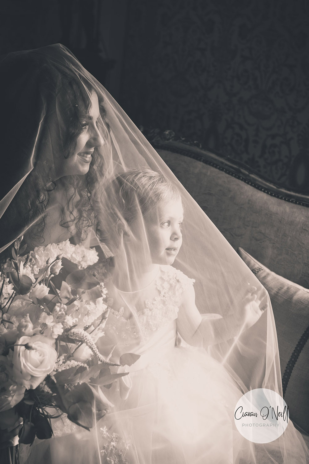 Bride with flowergirl in window Cabra Castle Wedding Ciaran O'Neill Photography