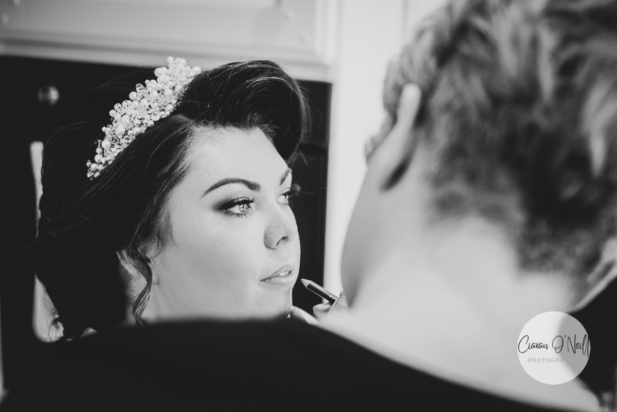 Bride getting make-up touched up