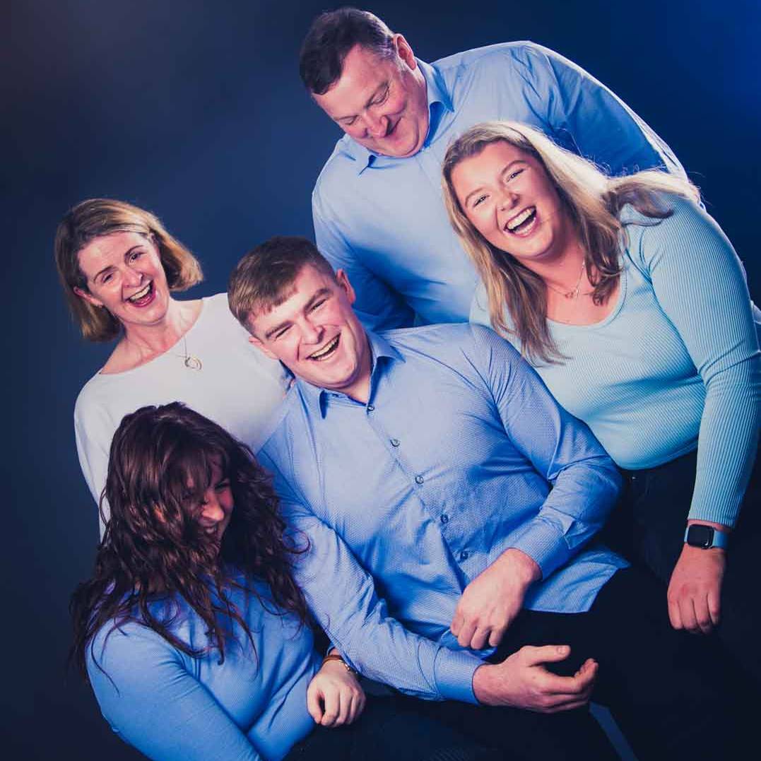 Brody family laughing during a photo