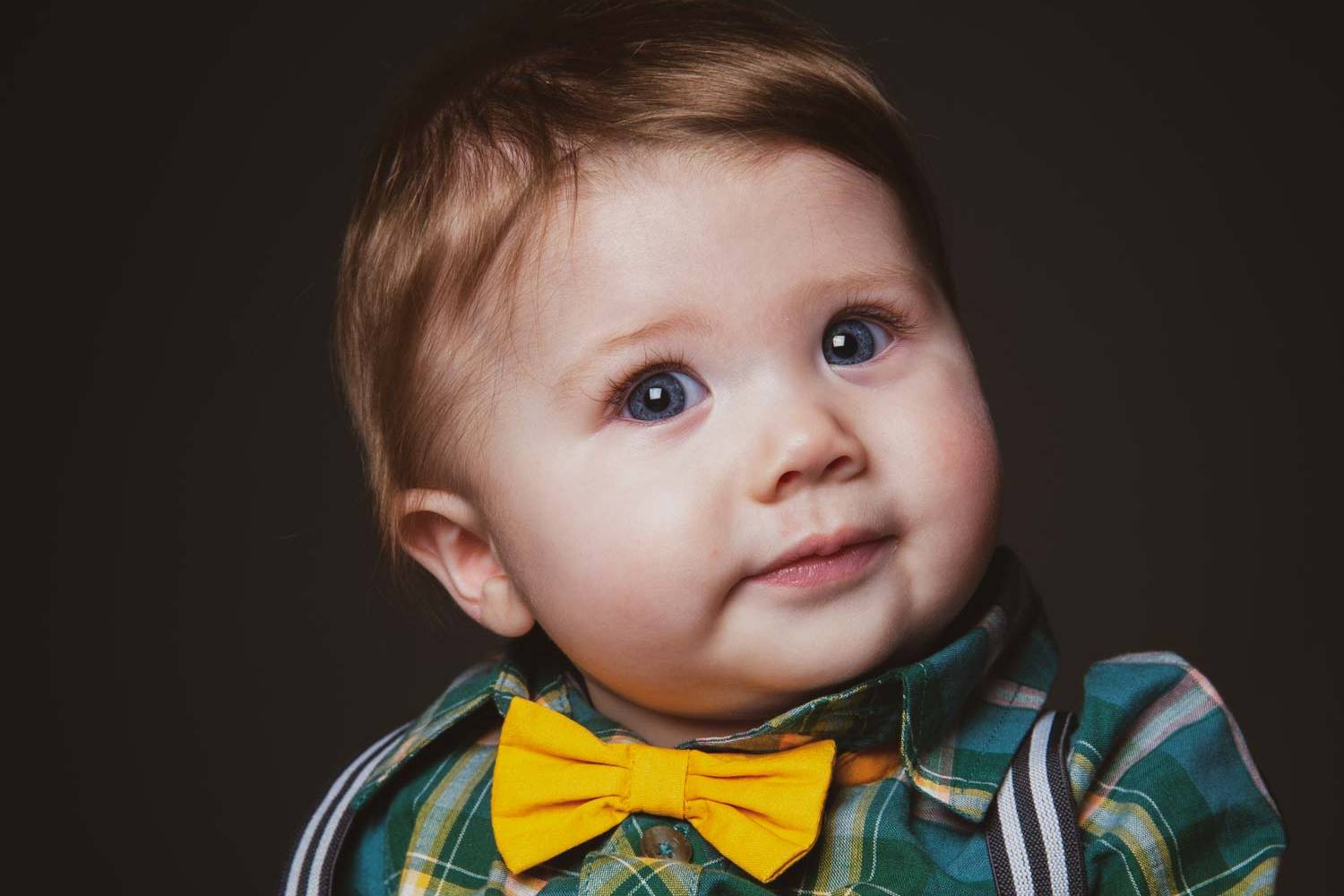 Baby boy wearing a yellow dickie bow