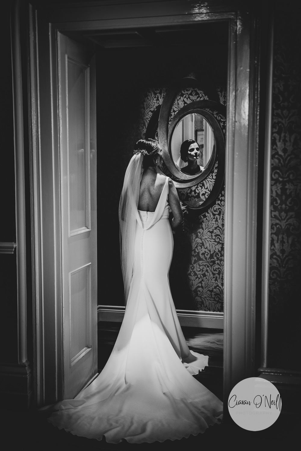 Bride looking into a mirror