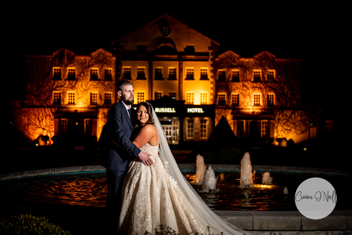 Night time shot of the couple outside Slieve Russell Hotel