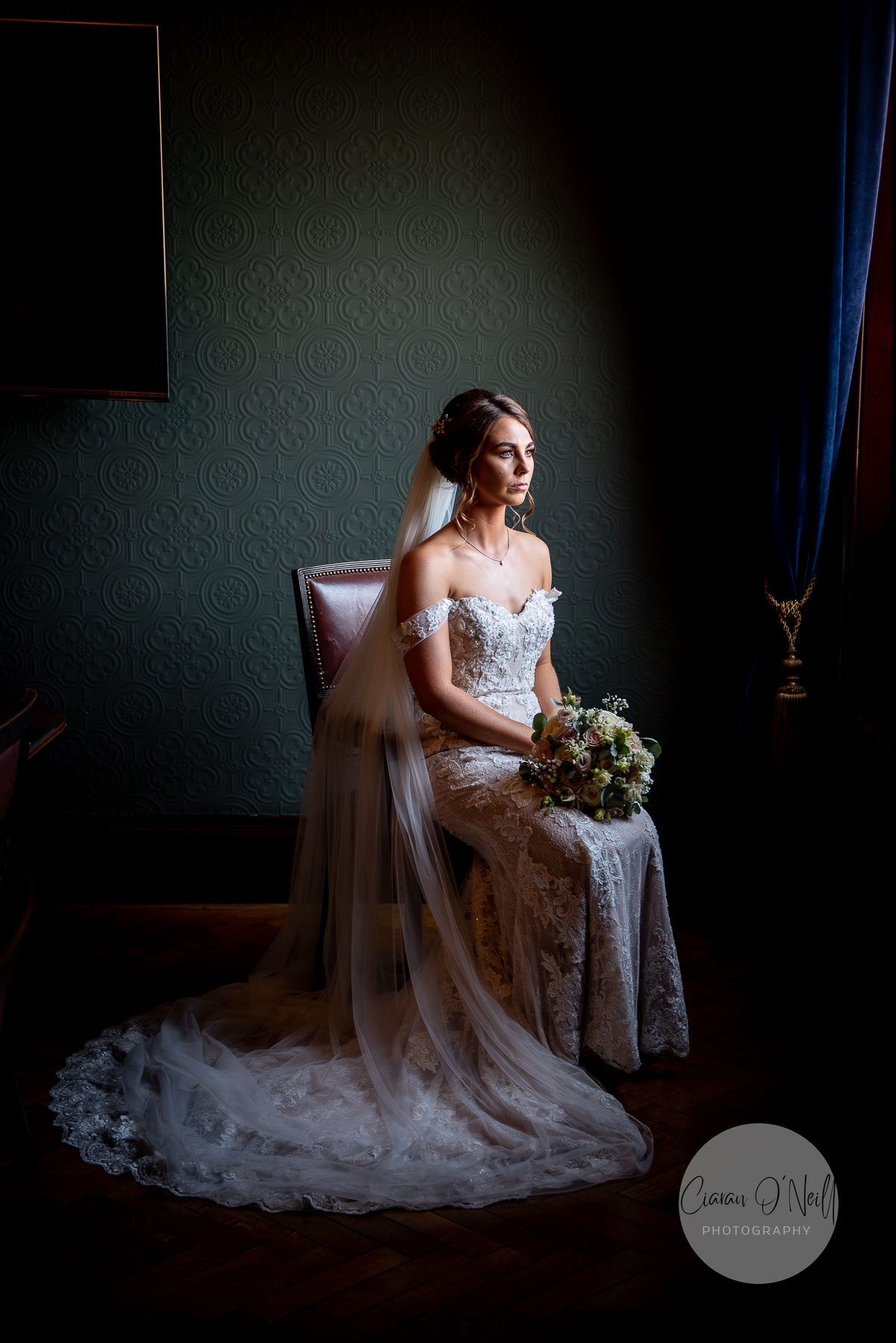 Bride sitting at the window in Titanic Hotel Belfast