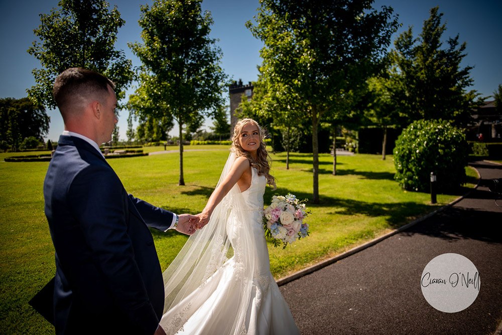 Bride leads groom towards Darver Castle Wedding