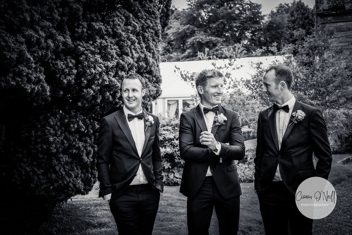 Groomsmen laugh with each other