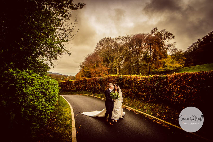 Couple enjoy a stroll along the lane at Killeavy Castle