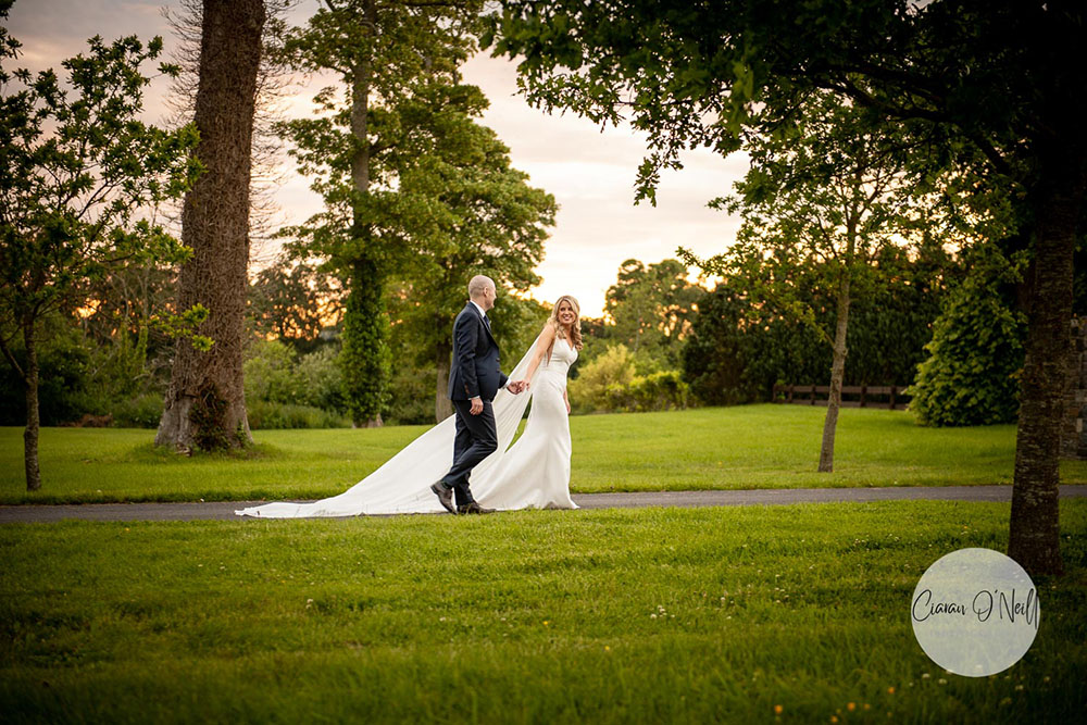bride and groom walking at sunset Darver Castle Wedding