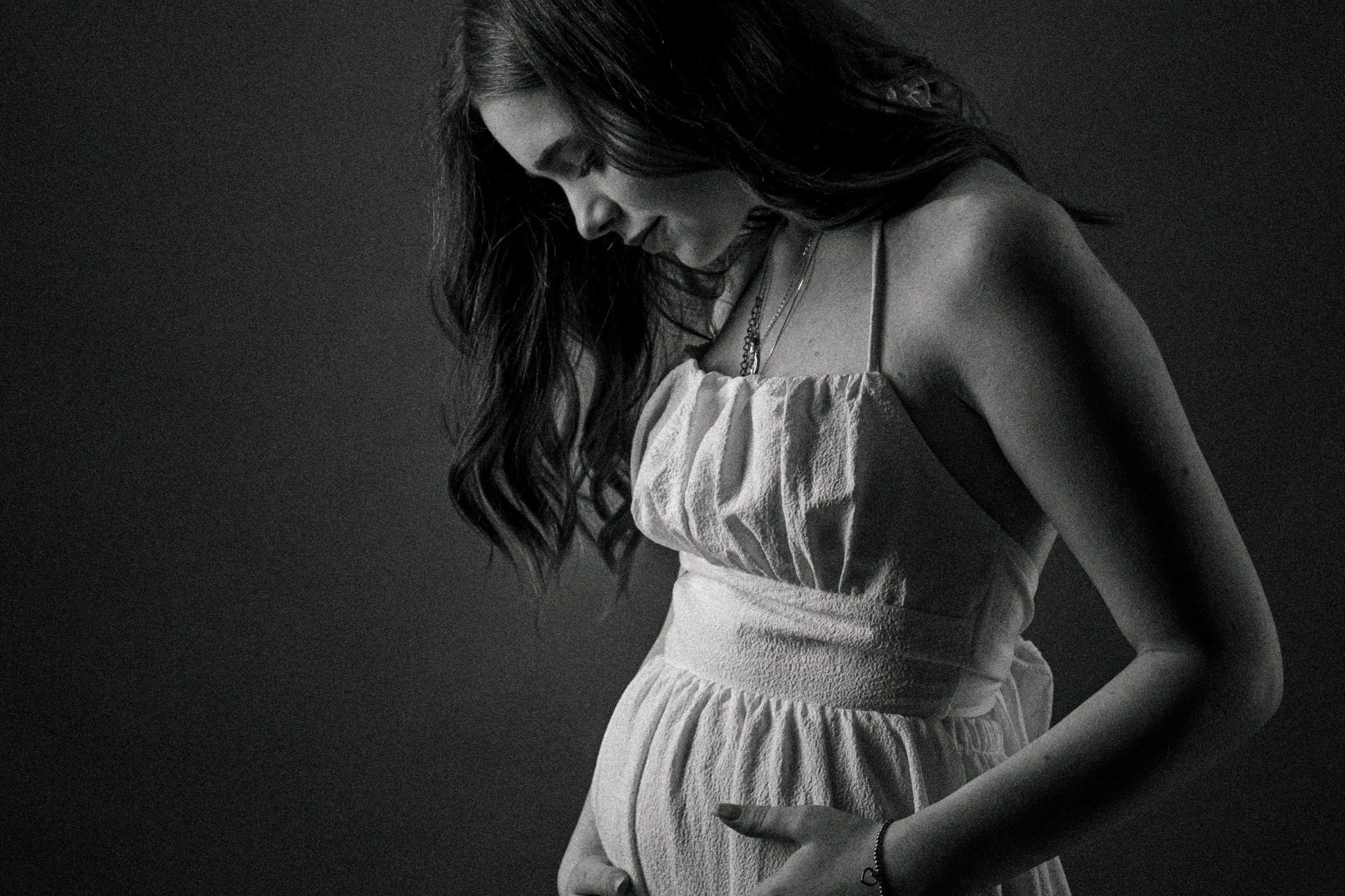 Black and white image of young expectant mum to be by Ciaran O'neill