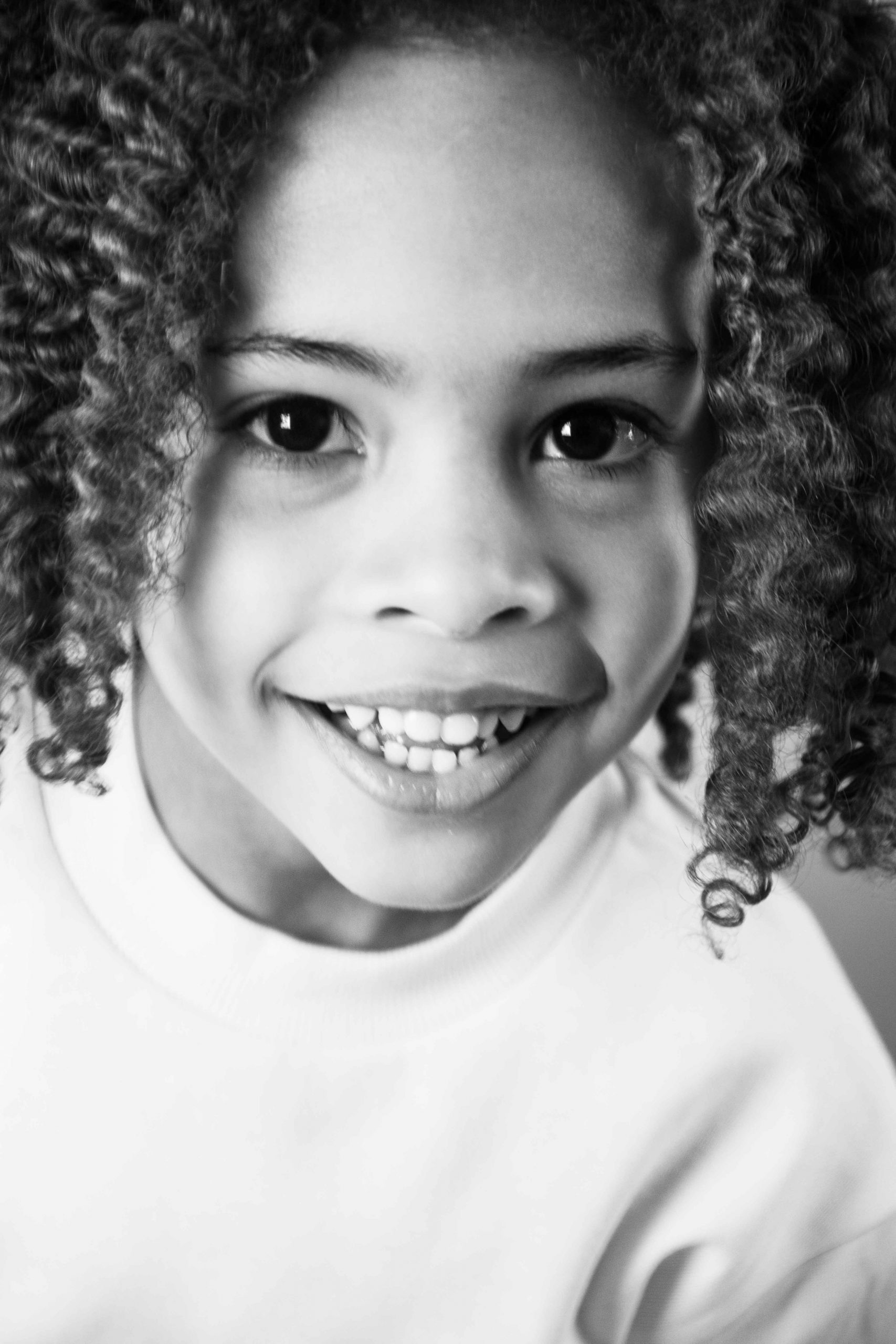 Young boy with dreadlocks in black and white
